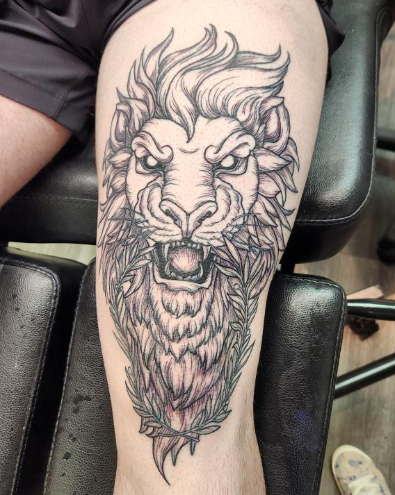 Lion head black and grey fine line outline by tattoo artist Britney Farmer of Sacred Mandala Studio.